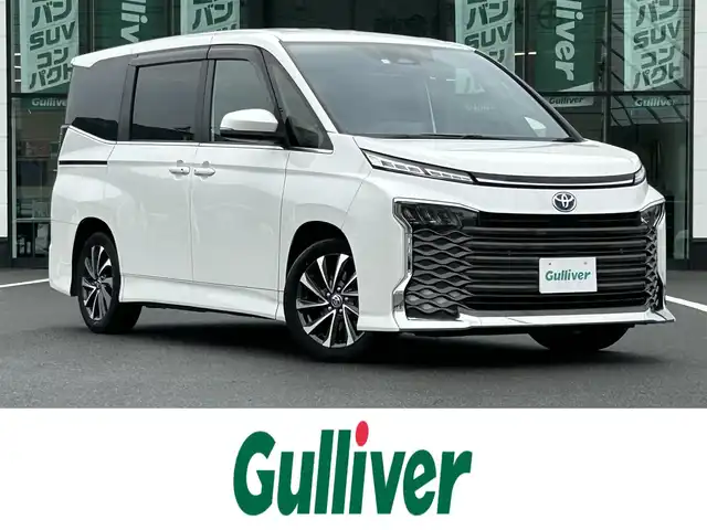 トヨタ ヴォクシー ハイブリッド S－Z 岡山県 2023(令5)年 4.5万km ホワイトパールクリスタルシャイン 車検R8年4月まで/登録時走行距離44558km/純正13.2インチ有機ELフリップダウンモニター/純正10.5インチナビ/フルセグTV/(AM.FM.TV.CD.DVD.USB.HDMI.BT)/両側パワースライドドア/シートヒーター/バックビューモニター/ETC2.0/レーダークルーズコントロール/衝突軽減ブレーキ/クリアランスソナー/100V充電/オートライト/オートマチックハイビーム/17インチ純正AW/横滑り防止装置/ワンオーナー