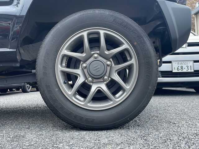 スズキ ジムニー XC 大阪府 2021(令3)年 3.7万km ミディアムグレーメタリック セーフティーサポート/・デュアルセンサーブレーキサポート/・誤発進抑制機能/・車線逸脱警報機能/・ふらつき警報機能/・先行車発進お知らせ機能/・ハイビームアシスト/ストラーダ社外ナビ/・Bluetooth/・フルセグTV/・バックカメラ/クルーズコントロール/アイドリングストップ/純正16インチアルミホイール/LEDヘッド/・オートライト/シートヒーター/プッシュスタート/ETC/新車保証書/取扱説明書