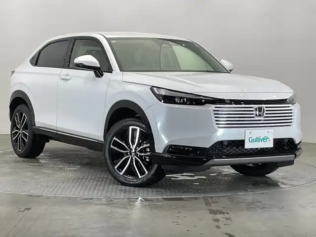 ホンダ ヴェゼル ハイブリッド e:HEV Z 栃木県 2025(令7)年 0.1千km プラチナホワイトパール 登録済未使用車/純正ナビ/(Bluetooth/フルセグTV/USB)/バックカメラ/ホンダセンシング/・衝突軽減ブレーキ/・誤発進抑制機能/・アダプティブクルーズコントロール/・車線維持支援システム/・路外逸脱抑制機能/・先行車発進お知らせ機能/・標識認識機能/・オートハイビーム/・トラフィックジャムアシスト/・アダプティブドライビングビーム/・ブラインドスポットインフォメーション/・後退出庫サポート/ビルトインETC2.0/ワイヤレス充電器/ハーフレザーシート/前席シートヒーター/パドルシフト/LEDヘッドライト/純正18インチAW/スマートキー/プッシュスタート