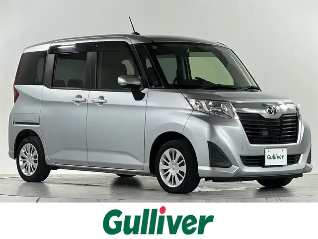 トヨタ ルーミー G 佐賀県 2017(平29)年 5.7万km ブライトシルバーM 社外7インチナビ/フルセグTV/CD/DVD/Bluetooth/両側パワースライドドア/横滑り防止装置/オートライト/前後ドライブレコーダー/クルーズコントロール/ETC/ウォークスルー/後席サンシェード/アイドリングストップ/スマートキー/スペアキー×１/純正ドアバイザー/純正フロアマット/禁煙車