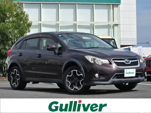 スバル インプレッサ ＸＶ 2．0i－L アイサイト 鹿児島県 2013(平25)年 5.4万km ディープチェリーパール 後付け前後コーナーセンサー　/レーダークルーズコントロール　/ビルトインＥＴＣ　/純正SDナビ（ＣＮ－３１０ＷＤ）　/Ｂｌｕｅｔｏｏｔｈオーディオ　/フルセグテレビ/Ｄ席パワーシート　/Ｄ＋Ｎ席シートヒーター/フルレザーシート/ＭＴモード付きＡＴ/パドルシフト/横滑り防止装置/プッシュスタート/スマートキー/ＨＩＤヘッドライト