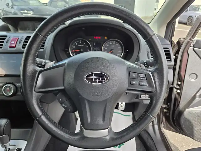 スバル インプレッサ ＸＶ 2．0i－L アイサイト 鹿児島県 2013(平25)年 5.4万km ディープチェリーパール 後付け前後コーナーセンサー　/レーダークルーズコントロール　/ビルトインＥＴＣ　/純正SDナビ（ＣＮ－３１０ＷＤ）　/Ｂｌｕｅｔｏｏｔｈオーディオ　/フルセグテレビ/Ｄ席パワーシート　/Ｄ＋Ｎ席シートヒーター/フルレザーシート/ＭＴモード付きＡＴ/パドルシフト/横滑り防止装置/プッシュスタート/スマートキー/ＨＩＤヘッドライト