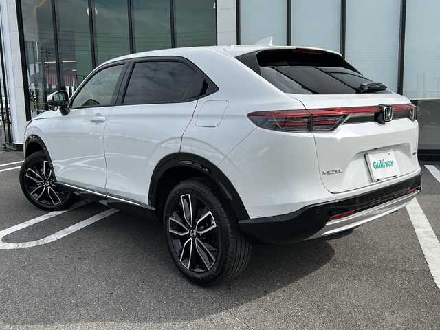 ホンダ ヴェゼル ハイブリッド e:HEV Z 岐阜県 2025(令7)年 0.1千km プラチナホワイトパール 登録時走行距離：3km/登録済み未使用車/Honda CONNECTディスプレー/バックモニター/フルセグテレビ/クルーズコントロール/ETC2.0車載器/ワイヤレス充電器/Honda SENSING/ブラインドスポットインフォメーション/アダプティブドライビングビーム(ADB)/後退出庫サポート/運転席助手席シートヒーター/ハンズフリーアクセスパワーテールゲート(予約クローズ機能付)/LEDシーケンシャルターンシグナルランプ/18インチアルミホイール/コンビシート（シートヒータ・エアシート）/ハーフレザーシート/本革巻きステアリングアイドリングストップ/保証書