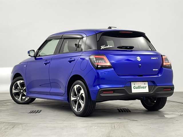 スズキ スイフト HYBRID MZ 愛知県 2024(令6)年 1.4万km 青 禁煙車/純正ディスプレイオーディオ/(AM/FM/USB/BT//iPod)/バックカメラ/ビルトインETC/フロントサイドスポイラー/シートヒーター/前後ドライブレコーダー/デュアルブレーキサポートII/ケンウッドスピーカー/プッシュスタート/スマートキー/ステアリングスイッチ/クルーズコントロール/BSM/LEDヘッドライト/オートライト/フロントフォグランプ/純正フロアマット/純正ドアバイザー