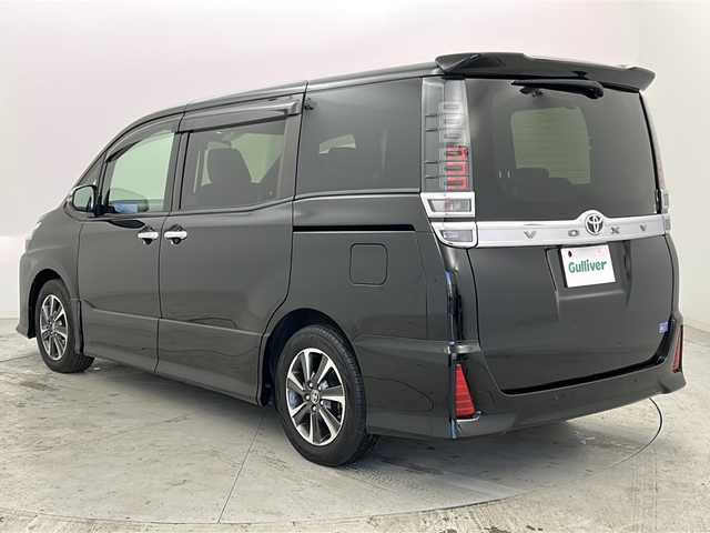 トヨタ ヴォクシー ZS 煌Ⅲ 宮城県 2020(令2)年 7.4万km ブラック 禁煙車/純正フリップダウンモニター/トヨタセーフティセンス/・プリクラッシュセーフティ/・レーンディパーチャーアラート/・オートマチックハイビーム/・先行車発進告知/クルーズコントロール/純正9インチSDナビ/・BT/CD/DVD/SD/フルセグTV/両側パワースライドドア/バックカメラ/前後ドライブレコーダー/ビルトインETC/ハーフレザーシート/革巻きステアリング/ステアリングスイッチ/プッシュスタート/スマートキー/後席ロールサンシェード/シートバックテーブル/LEDヘッドライト/LEDフォグランプ/純正16インチアルミホイール/純正ドアバイザー/社外フロアマット/横滑り防止装置/アイドリングストップ