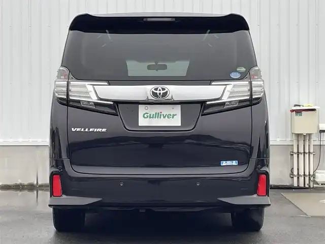 トヨタ ヴェルファイア Z 愛媛県 2015(平27)年 2.5万km バーニングブラッククリスタルシャインガラスフレーク 純正ナビ/(Bluetooth/CD/SD/DVD/フルセグ)/ビルトインETC/バックカメラ/フリップダウンモニター/両側パワースライドドア/純正18インチアルミホイール/オートライト/LEDヘッドライト/フォグランプ/プッシュスタート/スマートキー/3列シート/フロアマット/純正ドアバイザー/オットマン/横滑り防止装置/盗難防止装置/電動格納ミラー/オートリトラクタブルミラー/電動パーキングホールド/オートブレーキホールド/スペアタイヤ