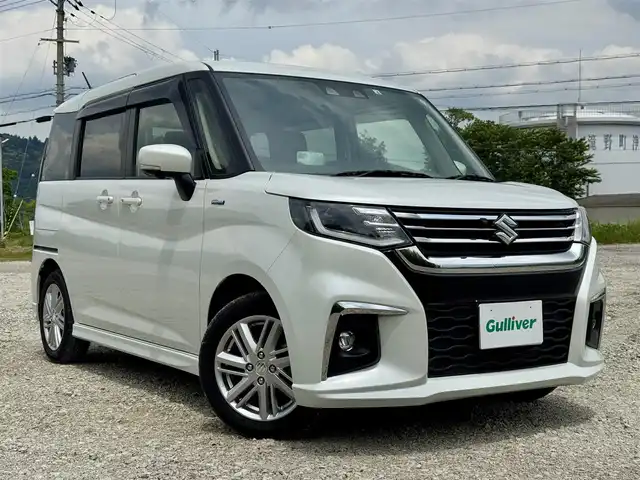 スズキ ソリオ HV MZ 兵庫県 2022(令4)年 1.1万km ピュアホワイトP 純正8インチナビ/全方位モニター/フルセグTV/Bluetooth接続可/DVD再生可/ナビ連動前後ドラレコ/レーダークルーズコントロール/ビルトインETC/両側パワースライドドア/純正15インチAW/LEDヘッドライト
