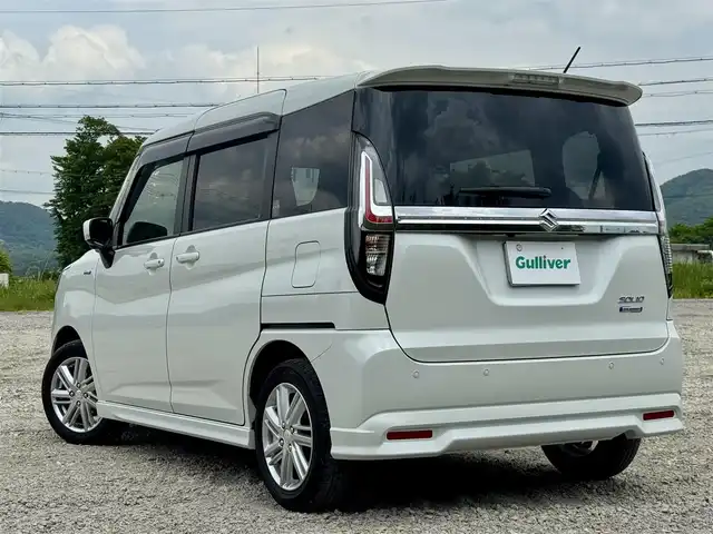 スズキ ソリオ HV MZ 兵庫県 2022(令4)年 1.1万km ピュアホワイトP 純正8インチナビ/全方位モニター/フルセグTV/Bluetooth接続可/DVD再生可/ナビ連動前後ドラレコ/レーダークルーズコントロール/ビルトインETC/両側パワースライドドア/純正15インチAW/LEDヘッドライト