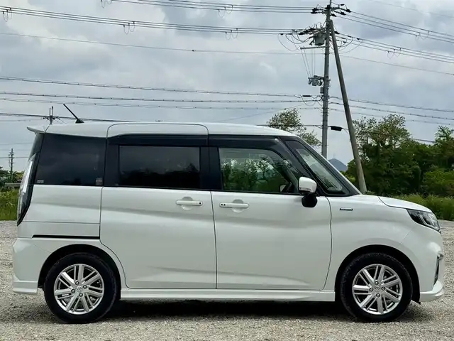 スズキ ソリオ HV MZ 兵庫県 2022(令4)年 1.1万km ピュアホワイトP 純正8インチナビ/全方位モニター/フルセグTV/Bluetooth接続可/DVD再生可/ナビ連動前後ドラレコ/レーダークルーズコントロール/ビルトインETC/両側パワースライドドア/純正15インチAW/LEDヘッドライト