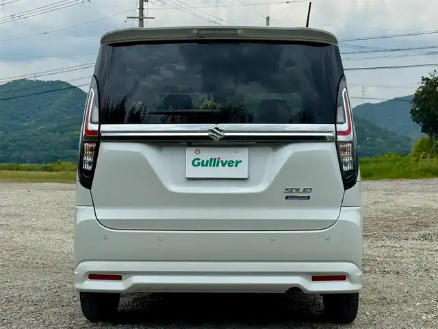スズキ ソリオ HV MZ 兵庫県 2022(令4)年 1.1万km ピュアホワイトP 純正8インチナビ/全方位モニター/フルセグTV/Bluetooth接続可/DVD再生可/ナビ連動前後ドラレコ/レーダークルーズコントロール/ビルトインETC/両側パワースライドドア/純正15インチAW/LEDヘッドライト