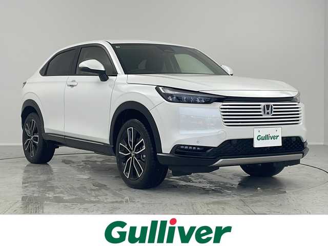 ホンダ ヴェゼル ハイブリッド e:HEV Z 茨城県 2025(令7)年 0.1千km プラチナホワイトパール 登録済未使用車/ホンダセンシング/純正9インチ Honda CONNECTナビ/ （AM/FM/BT/USB/フルセグTV）/バックカメラ/レーダークルーズコントロール/レーンキープアシスト/コーナーセンサー/ブラインドスポットモニター/オートハイビーム/ハーフレザーシート/シートヒーター/横滑り防止装置/オートLEDヘッドライト/フォグライト/純正アルミホイール/置くだけ充電/革巻きステアリング/ステアリングスイッチ/ステアリングヒーター/ETC2.0