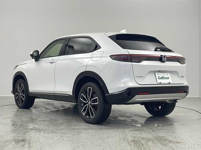 ホンダ ヴェゼル ハイブリッド e:HEV Z 茨城県 2025(令7)年 0.1千km プラチナホワイトパール 登録済未使用車/ホンダセンシング/純正9インチ Honda CONNECTナビ/ （AM/FM/BT/USB/フルセグTV）/バックカメラ/レーダークルーズコントロール/レーンキープアシスト/コーナーセンサー/ブラインドスポットモニター/オートハイビーム/ハーフレザーシート/シートヒーター/横滑り防止装置/オートLEDヘッドライト/フォグライト/純正アルミホイール/置くだけ充電/革巻きステアリング/ステアリングスイッチ/ステアリングヒーター/ETC2.0