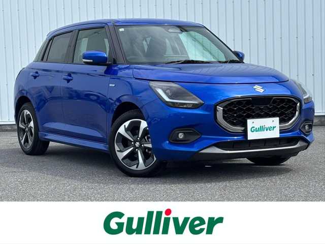 スズキ スイフト HYBRID MZ 滋賀県 2023(令5)年 1.2万km フォギーブルーパールメタリック 純正９型ディスプレイ/・Bluetooth/apple Car　Play/革巻きステアリング/ステアリングリモコン/パドルシフト/アダプティブクルコン/前席シートヒーター/LEDオートライト/フォグライト/スマートキー/スズキセーフティサポート/・デュアルセンサーブレーキサポート/・誤発進抑制機能/・ブラインドスポットモニター/・アダプティブハイビームシステム/・標識認識機能/・車線維持支援機能