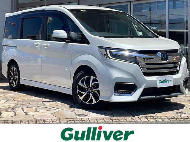 ホンダ ステップワゴン スパーダ ホンダセンシング 静岡県 2020(令2)年 5.1万km プラチナホワイトパール 【安全装備】/ホンダセンシング/アダプティブ・クルーズ・コントロール（ACC）/・作動車速域：約30km/hから100km/h間/車線維持支援システム（LKAS）/・作動車速：約65km/hから100km/h間/・ステアリング制御/衝突軽減ブレーキ（CMBS）/・歩行者検知機能/・作動車速：約80km/h未満時/・対向車車速：約30km/hから80km/h時/誤発進抑制機能（前進）/・ミリ波レーダー検知：作動車速10km/h未満/歩行者事故低減ステアリング/・作動車速10km/hから40km/h間/路外逸脱抑制機能/・作動車速：約60km/hから100km/h間/先行車発進お知らせ機能/標識認識機能/【主要装備】/10インチ純正ナビ　/純正１６インチアルミホイール　/両側パワースライドドア　/バックカメラ　/11.6インチ後席フリップダウンモニター　/わくわくゲート　/LEDヘッドライト/LEDフォグ/スマートキー/プッシュスタート/スペアキー有り