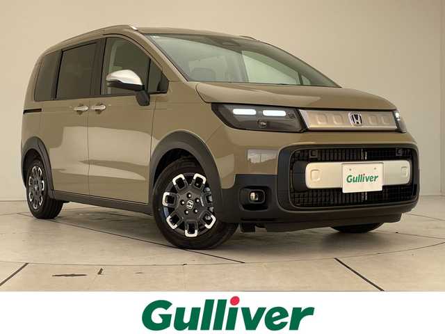 ホンダ フリード ハイブリット e:HEV クロスター 愛知県 2025(令7)年 0.1千km 茶Ｍ 登録済未使用車/純正9型ディスプレイオーディオナビ/両側パワースライドドア/レーダークルーズコントロール/シートヒーター/バックカメラ/コーナーセンサー/ブラインドスポットモニター/LEDヘッドライト/オートマチックハイビーム/衝突軽減システム/フルセグ/Bluetooth/ステアリングスイッチ/スマートキー/プッシュスタート