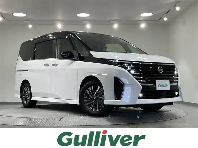 日産 セレナ e－パワー ハイウェイスター V 愛知県 2024(令6)年 1.3万km 白Ⅱ 純正１２．３インチナビ/（Bluetooth/フルセグTV/CarPlay/HDMI)　/純正フリップダウンモニター　/防水シート　/プロパイロット　/衝突軽減ブレーキ　/両側電動スライドドア　/アラウンドビューモニター　/100V電源　/ビルトインＥＴＣ２．０　/シートヒーター　/LEDヘッドライト/ワイヤレス充電/デジタルインナーミラー/ステアリングヒーター