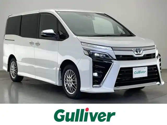 トヨタ ヴォクシー ハイブリッド ZS 煌Ⅲ 愛知県 2021(令3)年 5.7万km ホワイトパールクリスタルシャイン 純正１０型ナビ　フルセグＴＶ　純正１２．１型後席モニター　ハーフレザー　シートヒーター　バックカメラ　ＥＴＣ２．０　前後ドラレコ　衝突軽減　クルコン　ＬＥＤオートライト　コーナーセンサ　フォグランプ　レザー調シートカバー　トヨタセーフティセンス　禁煙車
