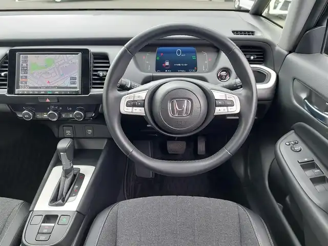 ホンダ フィット e:HEVホーム 東京都 2023(令5)年 1.8万km クリスタルブラックパール 純正ナビ/バックカメラ/フルセグ/衝突軽減システム/レーンキープアシスト/コーナーセンサー/レーダークルーズコントロール/ハーフレザーシート/LEDヘッドライト/オートライト/ECON