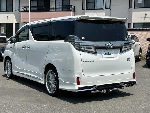 トヨタ ヴェルファイア ハイブリット ZR 道央・札幌 2018(平30)年 8.5万km ホワイトパールクリスタルシャイン 登録時走行距離　84163km/　4　W　D　/７人乗り/ワンオーナー/寒冷地仕様/フルモデリスタエアロ/WORK20インチAW装着/Toyota Safety Sense/・プリクラッシュセーフティ/・レーンディバーチャーアラート/・クリアランスソナー/・オートマチックハイビーム/・レーダークルーズコントロール/純正ディーラーOPナビ/(AM/FM/CD/DVD/HDMI/BT/SD)/フルセグTV/バックカメラ/純正フリップダウンモニター/両側パワースライドドア/パワーバックドア/デジタルインナーミラー/ビルトインETC/純正前方ドライブレコーダー/スマートキー１体型エンジンスターター/黒革シート/シートヒーター/エアシート/前席パワーシート/助手席オットマンシート/運転席シートメモリ/フロントワイパーデアイサー/三眼LEDヘッドライト/シーケンシャルウィンカー/ウッドコンビ革巻ステアリング/AC100V/SUNTREXヒッチメンバー/純正AW付冬タイヤ積み込み/取説/保証書
