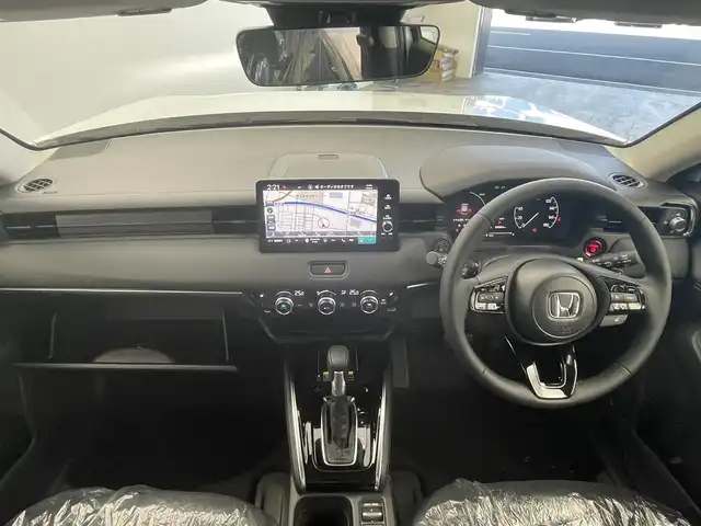 ホンダ ヴェゼル ハイブリッド e:HEV Z 群馬県 2025(令7)年 0.1千km プラチナホワイトパール e:HEV Z　3VC4AG3　Honda CONNECTディスプレー+ETC2.0車載器+ワイヤレス充電器(220/000)/登録済未使用車　純正９インチナビ　アダプティブクルーズコントロール　レーンアシスト　ビルトインＥＴＣ２．０　ワイアレス充電　ＢＳＭ　パワーバックドア　障害物センサー　オートマチックハイビーム　禁煙車
