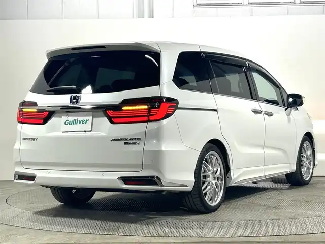 ホンダ オデッセイ ハイブリッド e:HEVアブソルート EX 大阪府 2021(令3)年 1.1万km プラチナホワイトパール 純正１１ｉｎｃナビ　後席モニター　３６０カメラ　衝突軽減ブレーキ　レーンアシスト　レーダークルーズＣ　両側パワースライドドア　ＥＴＣ　シートヒーター　コーナーセンサー　ＢＳＭ　　電動リアゲート