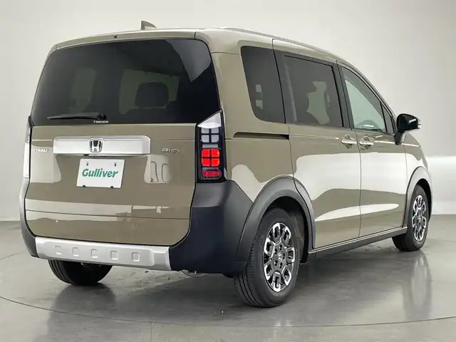 ホンダ フリード ハイブリット e:HEV クロスター 愛知県 2025(令7)年 0.1千km ベージュ 登録済未使用車　純正９型ナビ　禁煙　シートヒーター　ハーフレザー　電動パーキング　ホンダセンシング　衝突軽減　追従クルコン　ハンドル支援　コーナーセンサー　ＬＥＤオートライト　両側パワースライドドア　/登録時走行距離５ｋｍ/e:HEV クロスター　2LE40C3　6人　9インチナビ　LXM-242ZFNI(207680円)
