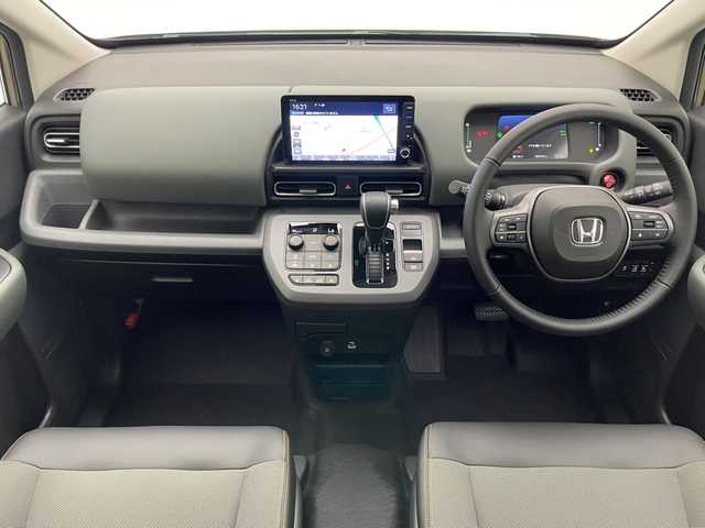 ホンダ フリード ハイブリット e:HEV クロスター 愛知県 2025(令7)年 0.1千km ベージュ 登録済未使用車　純正９型ナビ　禁煙　シートヒーター　ハーフレザー　電動パーキング　ホンダセンシング　衝突軽減　追従クルコン　ハンドル支援　コーナーセンサー　ＬＥＤオートライト　両側パワースライドドア　/登録時走行距離５ｋｍ/e:HEV クロスター　2LE40C3　6人　9インチナビ　LXM-242ZFNI(207680円)