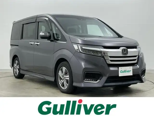 ホンダ ステップワゴン スパーダ eHEV G ホンダS 岡山県 2021(令3)年 4.1万km モダンスティールM 純正９インチナビ　(VXM-217VFNi)/【CD/DVD/USB/SD/フルセグ】/フリップダウンモニター　/両側電動スライド　/レーダークルーズコントロール　/ビルトインＥＴＣ２．０　/ＬＥＤヘッドライト　/バックカメラ　/ドライブレコーダー　/オートハイビーム　/フォグランプ/禁煙車/オートブレーキホールド/純正フロアマット/純正アルミ/アイドリングストップ