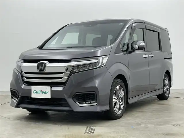 ホンダ ステップワゴン スパーダ eHEV G ホンダS 岡山県 2021(令3)年 4.1万km モダンスティールM 純正９インチナビ　(VXM-217VFNi)/【CD/DVD/USB/SD/フルセグ】/フリップダウンモニター　/両側電動スライド　/レーダークルーズコントロール　/ビルトインＥＴＣ２．０　/ＬＥＤヘッドライト　/バックカメラ　/ドライブレコーダー　/オートハイビーム　/フォグランプ/禁煙車/オートブレーキホールド/純正フロアマット/純正アルミ/アイドリングストップ