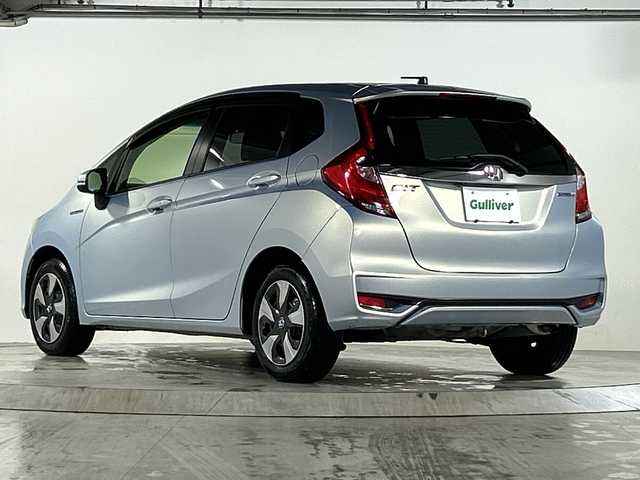 ホンダ フィット ハイブリット L ホンダセンシング 広島県 2019(平31)年 2.7万km モーニングミストブルーM 禁煙車/純正ナビ/（Bluetooth/SD/CD/USB)/バックカメラ/前後ドライブレコーダー/ビルドインETC/レーダークルーズコントロール/オートライト/LEDヘッドライト/フォグランプ/純正フロアマット/ドアバイザー/ハーフレザーシート/チャップアップシート/衝突被害軽減ブレーキ/横滑り防止装置/レーンキープアシスト/スマートキー/電動格納ミラー