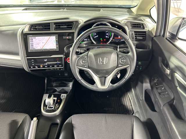 ホンダ フィット ハイブリット L ホンダセンシング 広島県 2019(平31)年 2.7万km モーニングミストブルーM 禁煙車/純正ナビ/（Bluetooth/SD/CD/USB)/バックカメラ/前後ドライブレコーダー/ビルドインETC/レーダークルーズコントロール/オートライト/LEDヘッドライト/フォグランプ/純正フロアマット/ドアバイザー/ハーフレザーシート/チャップアップシート/衝突被害軽減ブレーキ/横滑り防止装置/レーンキープアシスト/スマートキー/電動格納ミラー