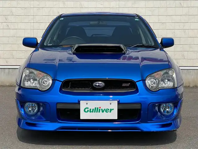 スバル インプレッサ ＷＲＸ STi 岐阜県 2003(平15)年 12.9万km WRブルーマイカ 6速MT/4WD/ターボ/純正BBS17インチAW/brembo製ゴールドキャリパー/BLITZ車庫調/HKSスポーツマフラー/Defiレーサーゲージ/カロッツェリア製メインユニット/（Bluetooth/CD/USB）/3本スポーク本革巻きステアリング/本革巻きシフトノブ/スポーツアルミペダル/キセノンヘッドライト/DCCDデフロックインジケーター/Panasonic製ツインスピーカー/Panasonic製ETC/純正フロアマット/パワーウィンドウ/マニュアルエアコン/電動格納ミラー