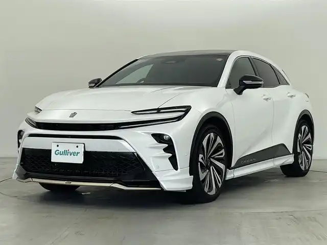 トヨタ クラウン スポーツ Z 群馬県 2024(令6)年 1.5万km プレシャスホワイトパール モデリスタエアロ（フロント/サイド/リアアンダー）/モデリスタ21インチアルミホイール/パノラマルーフ/＝＝＝＝＝/純正12.3インチディスプレイオーデイオPlus/・トヨタプレミアムサウンドシステム/・AM/FM/Bluetooth/フルセグTV/・USB/AppleCarPlay/AndroidAuto/Miracast/・前後ドライブレコーダー/パノラミックビューモニター/本革シート/前席パワーシート/シートヒーター/シートベンチレーション/パワーシート /ポジションメモリー/トヨタセーフティセンス/・プリクラッシュセーフティ/・フロントクロストラフィックアラート/・レーンチェンジアシスト/レーントレーシングアシスト/・レーダークルーズコントロール/・アダプティブハイビームシステム/・ロードサインアシスト/ブラインドスポットモニター/安心降車アシスト/パーキングサポートブレーキ/ITS Connect/トヨタチームメイト/・アドバンスドパーク/・パーキングサポートブレーキ（周囲静止物）/デジタルインナーミラー/おくだけ充電（縦置き）/AC100V電源/ハンズフリーパワーバックドア/カラーHUD/ビルトインETC2.0