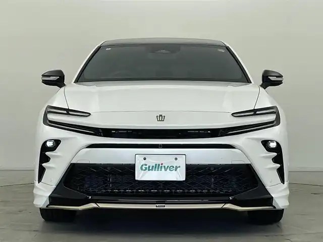 トヨタ クラウン スポーツ Z 群馬県 2024(令6)年 1.5万km プレシャスホワイトパール モデリスタエアロ（フロント/サイド/リアアンダー）/モデリスタ21インチアルミホイール/パノラマルーフ/＝＝＝＝＝/純正12.3インチディスプレイオーデイオPlus/・トヨタプレミアムサウンドシステム/・AM/FM/Bluetooth/フルセグTV/・USB/AppleCarPlay/AndroidAuto/Miracast/・前後ドライブレコーダー/パノラミックビューモニター/本革シート/前席パワーシート/シートヒーター/シートベンチレーション/パワーシート /ポジションメモリー/トヨタセーフティセンス/・プリクラッシュセーフティ/・フロントクロストラフィックアラート/・レーンチェンジアシスト/レーントレーシングアシスト/・レーダークルーズコントロール/・アダプティブハイビームシステム/・ロードサインアシスト/ブラインドスポットモニター/安心降車アシスト/パーキングサポートブレーキ/ITS Connect/トヨタチームメイト/・アドバンスドパーク/・パーキングサポートブレーキ（周囲静止物）/デジタルインナーミラー/おくだけ充電（縦置き）/AC100V電源/ハンズフリーパワーバックドア/カラーHUD/ビルトインETC2.0