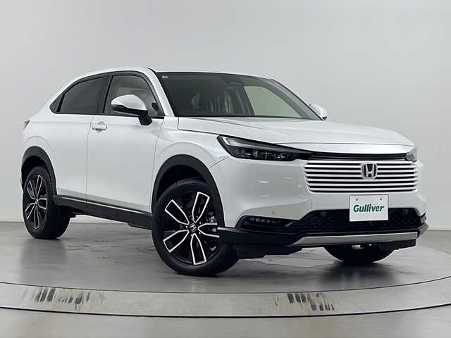 ホンダ ヴェゼル ハイブリッド e:HEV Z 埼玉県 2025(令7)年 0.1千km プラチナホワイトパール 登録済未使用車　/純正９インチナビ　/バックカメラ　/フルセグＴＶ　/パワーバックドア　/前後コーナーセンサー　/パドルシフト　/置くだけ充電　/純正ビルトインＥＴＣ２．０　/シートヒーター　/ハンドルヒーター　/ＢＳＭ