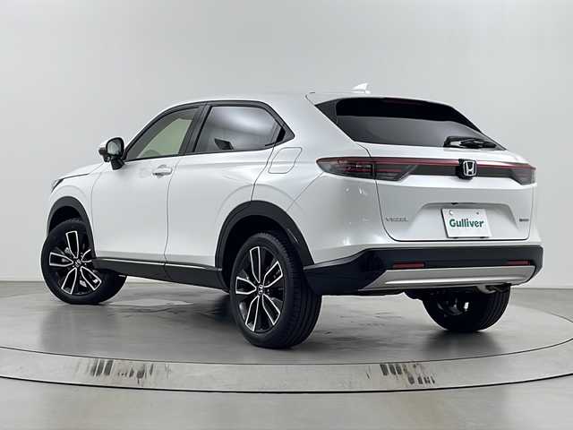ホンダ ヴェゼル ハイブリッド e:HEV Z 埼玉県 2025(令7)年 0.1千km プラチナホワイトパール 登録済未使用車　/純正９インチナビ　/バックカメラ　/フルセグＴＶ　/パワーバックドア　/前後コーナーセンサー　/パドルシフト　/置くだけ充電　/純正ビルトインＥＴＣ２．０　/シートヒーター　/ハンドルヒーター　/ＢＳＭ