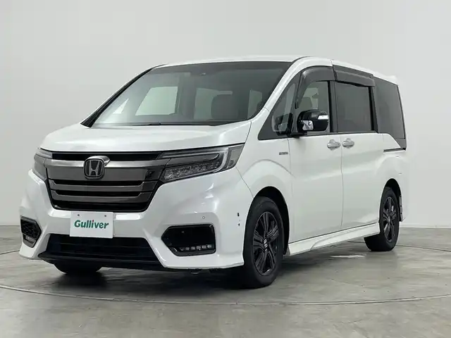 ホンダ ステップワゴン スパーダ ハイブリッドG EX HセンシングBスタイ 神奈川県 2019(平31)年 4.2万km プラチナホワイトパール ホンダセンシング/リアコーナーセンサー/純正９インチナビ/CD/DVD/SD/Bluetooth/フルセグTV/バックカメラ/純正１１．６型フリップダウンモニター/アダプティブクルーズコントロール/DN席シートヒーター/両側パワースライドドア/ステアリングリモコン/オートライト/LEDヘッドライト/LEDフォグライト/電動格納ミラー/ウィンカーミラー/純正AW/ETC/純正ドライブレコーダー（F）/社外ドライブレコーダー（R）/革巻きステアリング/ハーフレザーシート/純正フロアマット/プッシュスタート/スマートキー