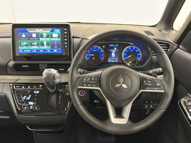三菱 デリカミニ T プレミアム 道央・札幌 2025(令7)年 0.1万km未満 緑Ｍ /4WD//純正ディスプレイオーディオ/（VTR/HDMI/Android Auto/Apple carplay)//三菱e-Assist/・衝突被害軽減システム/・踏み間違い衝突防止アシスト/・車線逸脱警報システム/・オートマチックハイビーム/・ふらつき警報/・前方衝突予測警報/・標識認識システム/・先行車発進通知/・ヒルディセントコントロール//革巻きステアリング//ステアリングスイッチ//パドルシフト//ハンドルヒーター//両側パワースライドドア//運転席・助手席シートヒーター//ウインカーミラー//デジタルミラー//後席プラズマクラスター付サーキュレーター