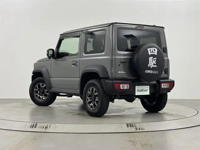 スズキ ジムニー シエラ JC 埼玉県 2024(令6)年 1.3万km ミディアムグレー ４WD/デュアルセンサーブレーキサポート/レーダークルーズコントロール/レーンキープアシスト/横滑り防止装置/盗難防止装置/ダウンヒルアシストコントロール/コーナーセンサー/衝突軽減システム/オートライト/LEDヘッドライト/純正15インチアルミホイール/ETC/プッシュスタート/スマートキー