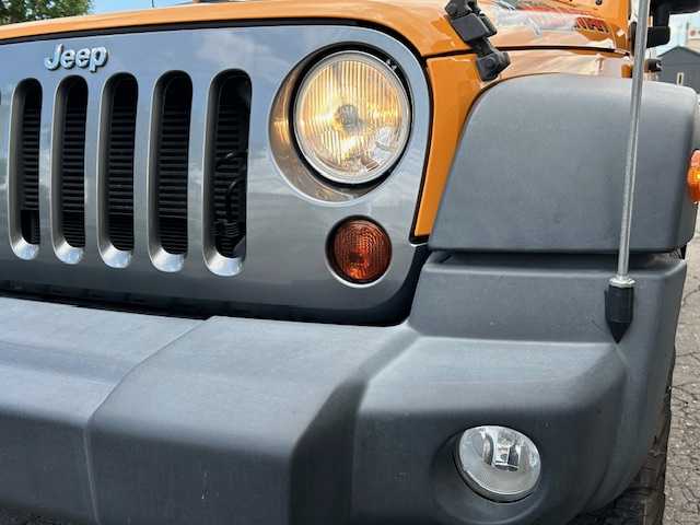 クライスラー・ジープ ジープ ラングラー マウンテン 道東・釧路十勝 2012(平24)年 7.1万km 黄 ４WD/社外SDナビ(AVIC-MRZ09)/CD/DVD/BT/フルセグTV/バックカメラ/左サイドカメラ/クルーズコントロール/革巻きステアリング/ミラーヒーター/ドアバイザー/ドライブレコーダー/ETC/キーレス