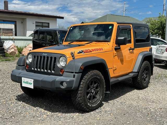 クライスラー・ジープ ジープ ラングラー マウンテン 道東・釧路十勝 2012(平24)年 7.1万km 黄 ４WD/社外SDナビ(AVIC-MRZ09)/CD/DVD/BT/フルセグTV/バックカメラ/左サイドカメラ/クルーズコントロール/革巻きステアリング/ミラーヒーター/ドアバイザー/ドライブレコーダー/ETC/キーレス