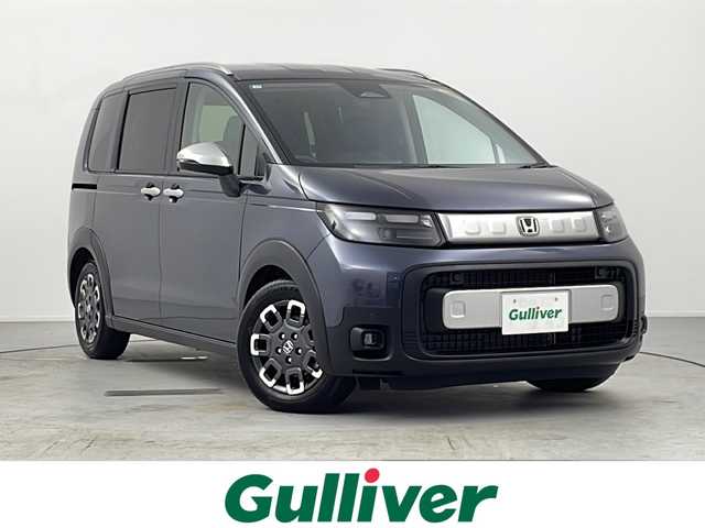 ホンダ フリード ハイブリット e:HEV クロスター 愛知県 2025(令7)年 0.1千km メテオロイドグレーメタリック /R7年10月登録済未使用車//純正HondaCONNECTナビ(LXM-242ZFNI)//フルセグTV・AMFM・Bluetooth・USB//AppleCarPlay・AndroidAuto//バックカメラ//HondaSENSING//前後パーキングセンサー//ブラインドスポットインフォメーション//オートハイビーム//フルLEDヘッドライト//オートライト//フロントフォグランプ//ルーフレール//両側パワースライドドア//後席サンシェード//プライムスムースコンビシート//2列目キャプテンシート//純正15インチアルミホイール//電子パーキングブレーキ//ブレーキホールド//革巻きステアリング//ステアリングスイッチ//プッシュスタート//電動格納ミラー//新車保証書・取扱説明書//スペアキー