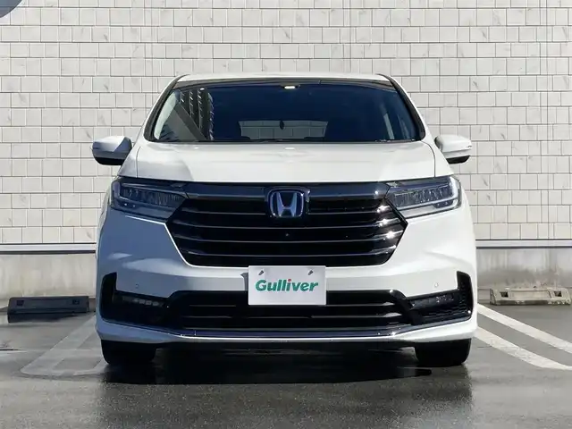 ホンダ オデッセイ ハイブリッド e:HEVアブソルート EX 静岡県 2021(令3)年 10.9万km プラチナホワイトパール Honda　SENSING/純正10インチナビ(VXU-217DYi)/　AM FM CD DVD Bluetooth USB SD AppleCarPlay/フルセグTV/前後方ドライブレコーダー/LEDオートヘッドランプ/レーダークルーズコントロール/シートヒーター(前席)/ハーフレザーシート/パワーバックドア/両側パワースライドドア/前後方クリアランスソナー/純正18インチアルミホイール/100Vソケット/ビルトインETC2.0/アラウンドビューモニター/パワーシート(前席)