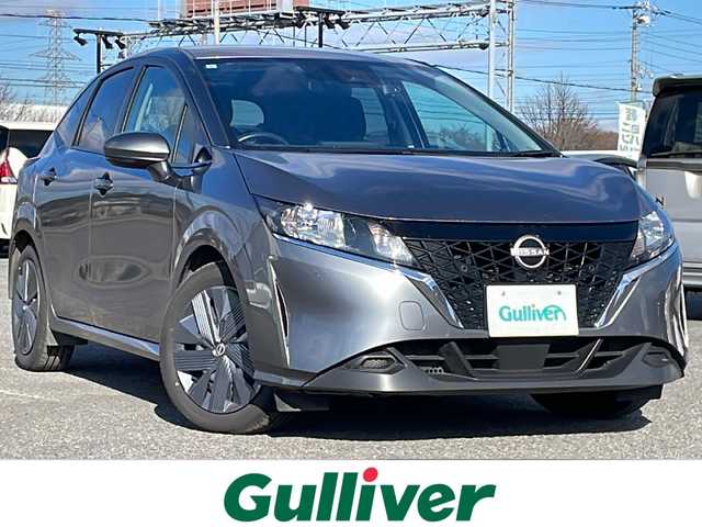 日産 ノート X FOUR 道央・札幌 2023(令5)年 6.9万km ダークメタルグレー ４WD/社外メモリーナビ/AM/FM/BT/衝突被害軽減ブレーキ/横滑り防止装置/クリアランスソナー/バックカメラ/ETC/ドライブレコーダー/アイドリングストップ/EVMODE/前席シートヒーター/革巻きステアリング/ステアリングリモコン/ハンドルヒーター/電動パーキング/オートブレーキホールド/プッシュスタート/スマートキー/ハロゲンヘッドライト/オートライト/ヘッドライトレベライザー/電動格納ミラー/ウィンカーミラー/社外フロアマット/スペアキー