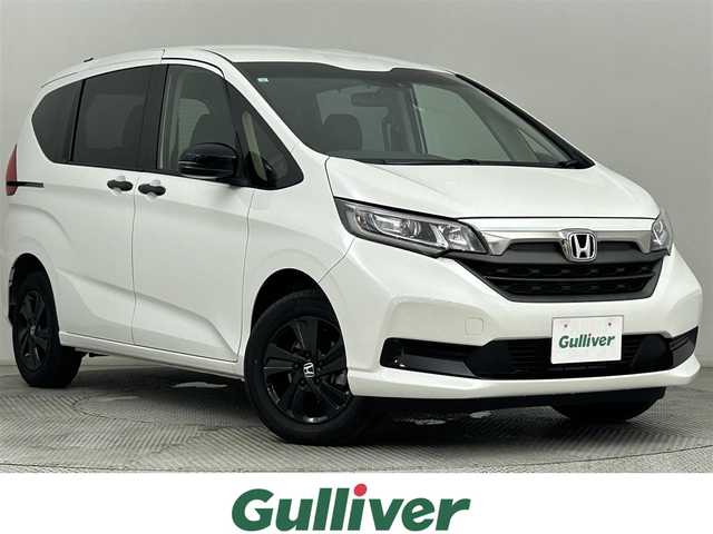 ホンダ フリード G ブラックスタイル 道央・札幌 2024(令6)年 1.4万km プラチナホワイトパール ・4WD/・衝突被害軽減ブレーキ/・レーンキープアシスト/・レーダークルーズコントロール/・コーナーセンサー/・社外ナビ/・バックカメラ/・Bluetooth/・両側パワースライドドア/・シートヒーター/・スマートキー/・プッシュスタート/・オートライト