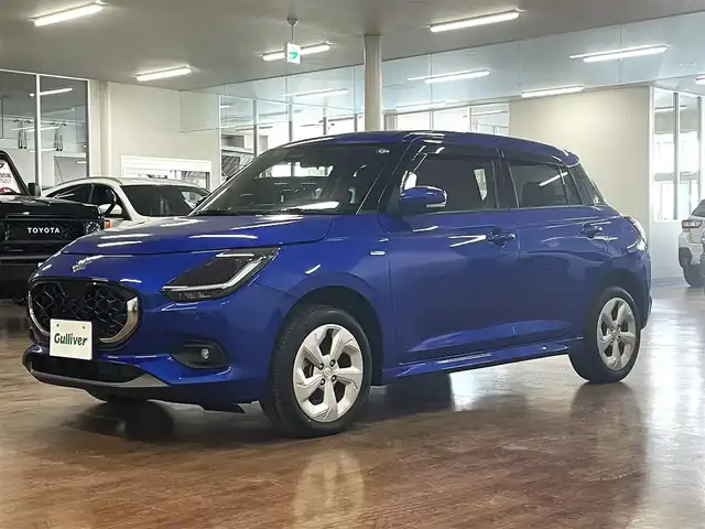 スズキ スイフト HYBRID MX 道央・札幌 2024(令6)年 2万km 青Ｍ ワンオーナー/4WD/衝突軽減ブレーキ/レーンキープアシスト/横滑り防止/アイドリングストップ/レーダークルーズコントロール/ブラインドスポットモニター/プッシュスタート/スマートキー×2/純正エンジンスターター/社外オーディオ/CD/Bluetooth/AUX/USB/AM/FM/シートヒーター（D/N）/ミラーヒーター/オートライト/純正フロアマット/純正ドアバイザー/LEDヘッドライト/フォグランプ/純正16インチAW/保証書/取扱説明書