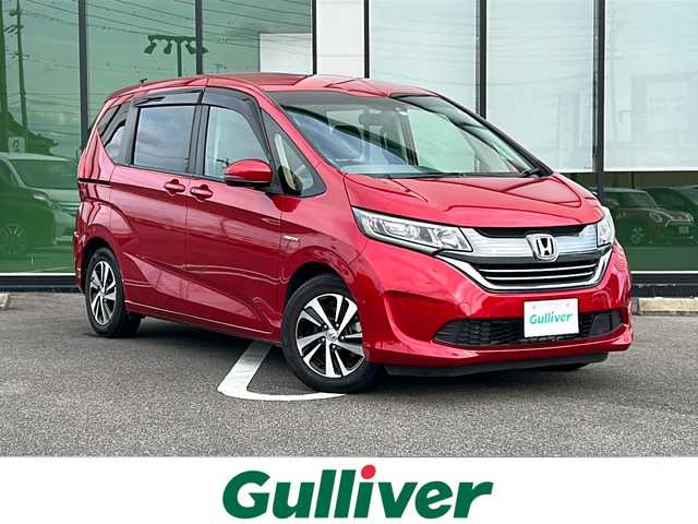 ホンダ フリード ハイブリット EX 岐阜県 2019(平31)年 5.7万km プレミアムクリスタルレッドM 登録時走行距離：56253km/９インチナビ/バックカメラ/フルセグテレビ・Bluetooth・CD・DVD・HDMI・USB/両側パワースライドドア/レーンキープアシスト/ETC/ハーフレザーシート/前席シートヒーター/ドライブレコーダー/ウォークスルー/オートライト/純正15インチアルミホイール/プッシュスタート/スマートキー/スペアキー/LEDヘッドライト/オートライト