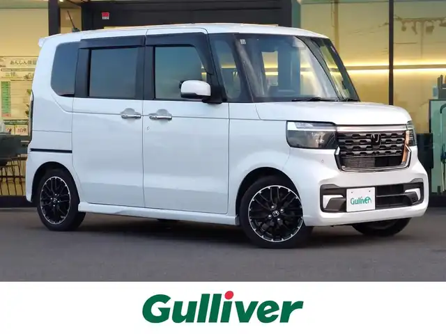 ホンダ Ｎ ＢＯＸ カスタム ターボ コーディネートS 東京都 2023(令5)年 2.6万km プラチナホワイトパール ワンオーナー/Honda SENSING/・衝突軽減ブレーキ/・誤発進抑制機能/・路外逸脱抑制機能/・アダプティブクルーズコントロール/・コーナーセンサー/プッシュスタート/パドルシフト/社外ナビ/フルセグTV/バックカメラ/ETC/ベンチシート/両側パワースライドドア/シートヒーター/シートバックテーブル/後席ロールサンシェード/LEDヘッドライト/オートライト/ドアバイザー/15インチ純正アルミホイール/スマートキー