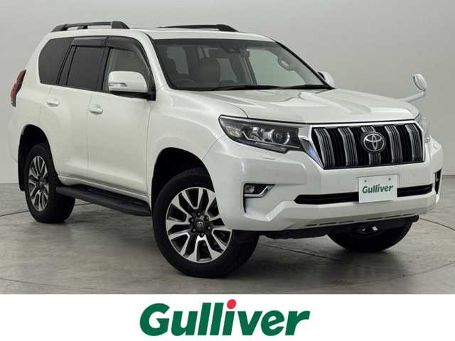 トヨタ ランドクルーザー プラド TX Lパッケージ 福岡県 2022(令4)年 3.4万km ホワイトパールクリスタルシャイン ムーンルーフ/７人乗り　/アルパインナビ／フルセグＴＶ　/バックカメラ　/ＥＴＣ　/ドラレコ　/トヨタセーフティセンス　/アクセル踏み間違い防止　/シートベンチレーション／ヒーター　/パワーシート　/純正１９インチＡＷ