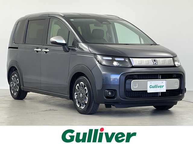 ホンダ フリード ハイブリット e:HEV クロスター 岐阜県 2025(令7)年 0.1千km メテオロイドグレーメタリック 純正9インチナビ/フルセグ/BT/USB/AppleCarPlay/バックカメラ/両側パワースライドドア/ハーフレザーシート/シートヒーター/革巻きステアリング/ステアリングスイッチ/レーダークルーズコントロール/コーナーセンサー/衝突軽減ブレーキ/レーンキープ/LEDヘッドライト